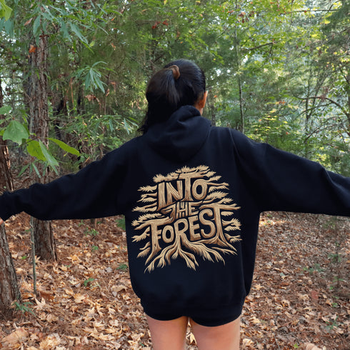 Featuring the phrase "Into the Forest" uniquely crafted in tree branch lettering, this design brings the beauty and mystery of the woods to life.
